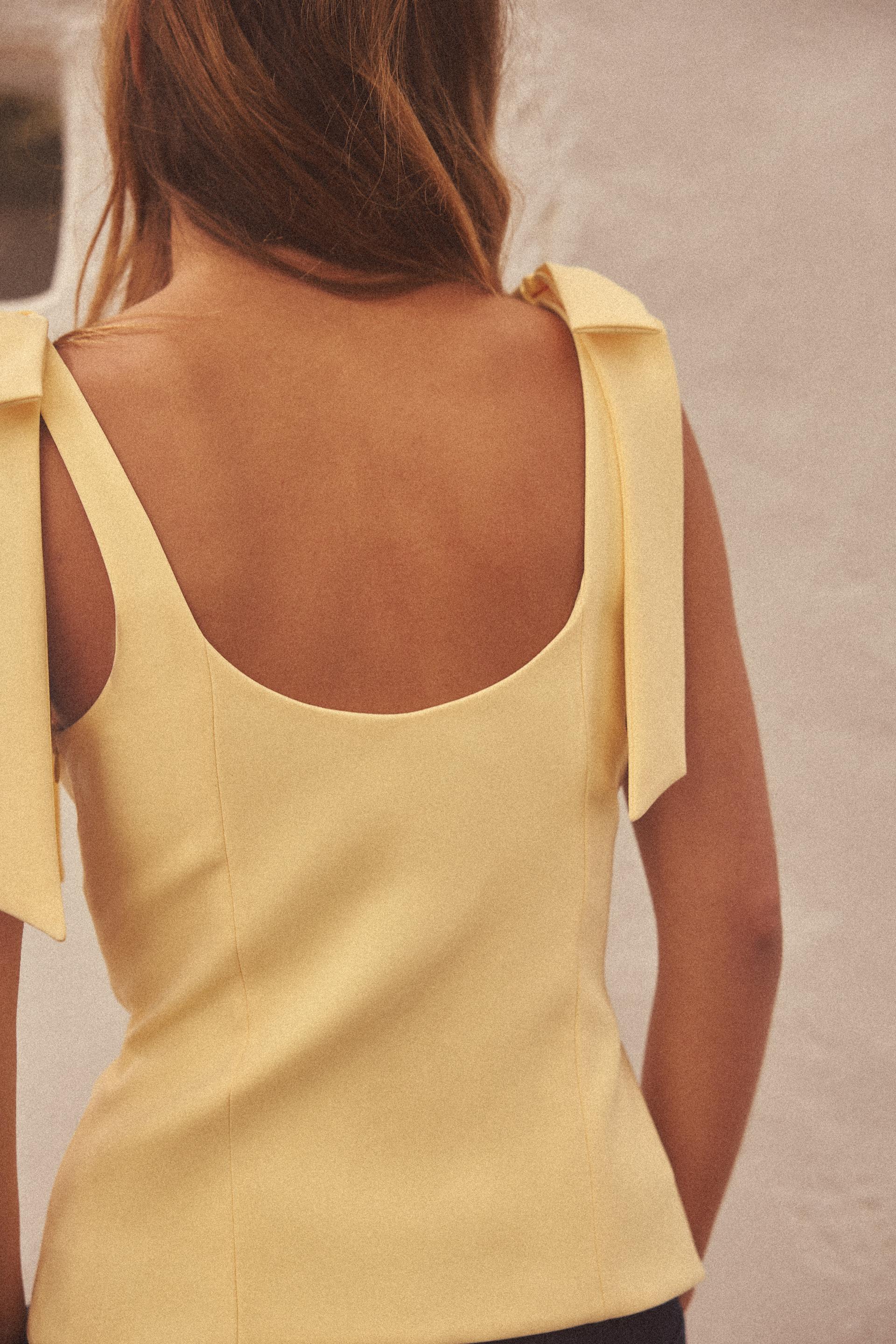 ELYNA STRETCH TOP WITH BOWS